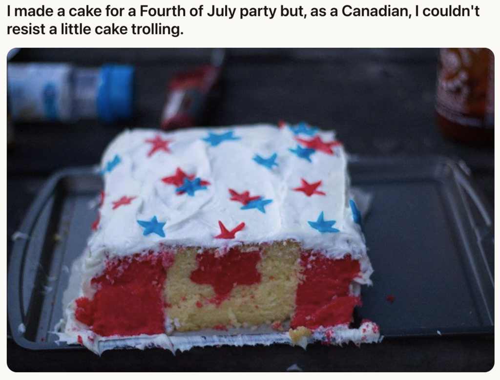 A cake with red and white icing and cutout red maple leaf shapes, resembling the Canadian flag, is placed on a tray. The icing has blue and red star decorations. Text above the cake humorously mentions "cake trolling" for a Fourth of July party.
